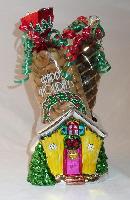 Ceramic colorful cottage/Cashews - A colorful ceramic cottage filled with 1 pound of cashews and  pound of chocolate covered caramel corn decorated with festive colored ribbons.